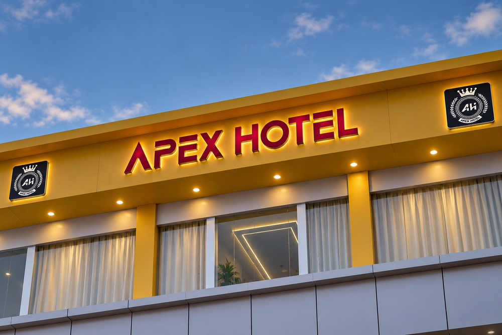 Apex Hotel building on Beldanga College Road at dusk